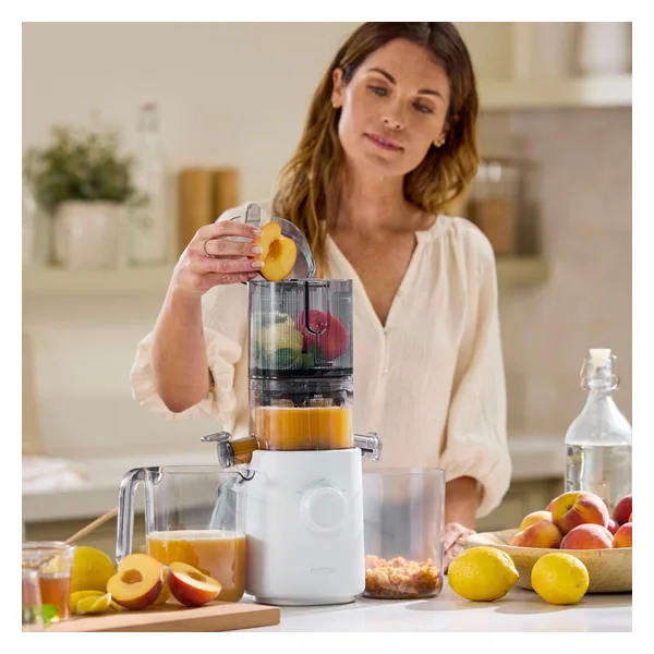 Nama J3 compact self-feeding cold-press juicer in use